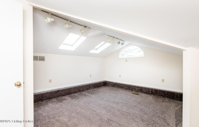 1031 Thruston Ave, Louisville, KY 40217 - bonus room with a skylight, carpet floors, lofted ceiling, and baseboards