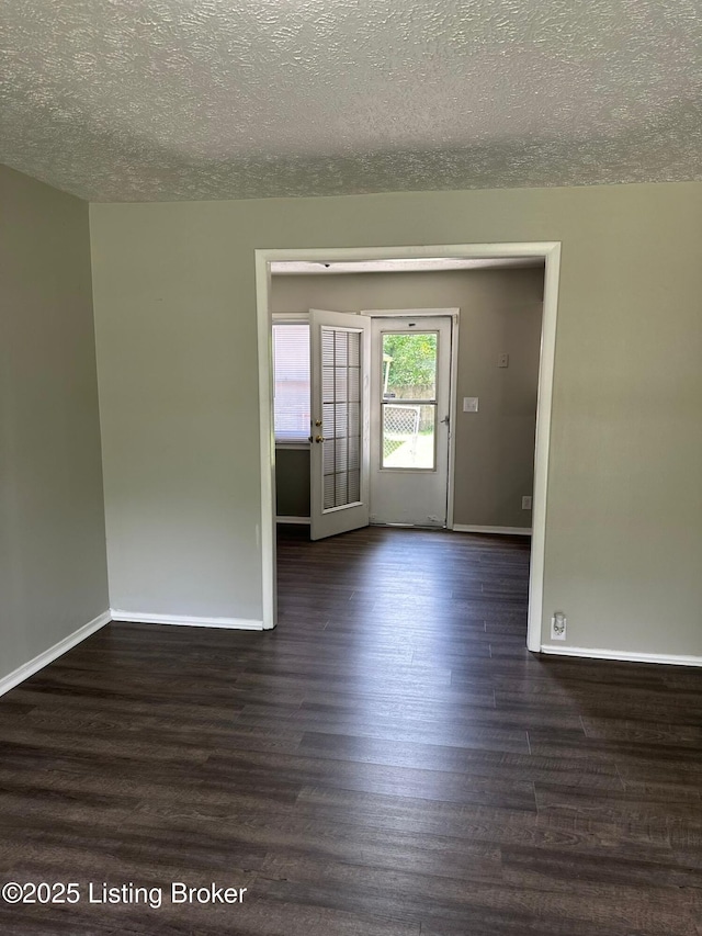 322 Mac Brae Rd, Louisville, KY 40214 - spare room featuring baseboards, wood finished floors, and a textured ceiling