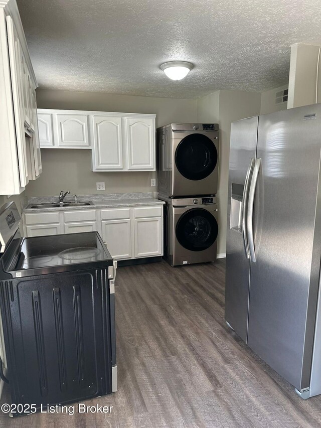 322 Mac Brae Rd, Louisville, KY 40214 - kitchen featuring stainless steel refrigerator with ice dispenser, stacked washer / dryer, electric stove, dark wood-style flooring, and a sink