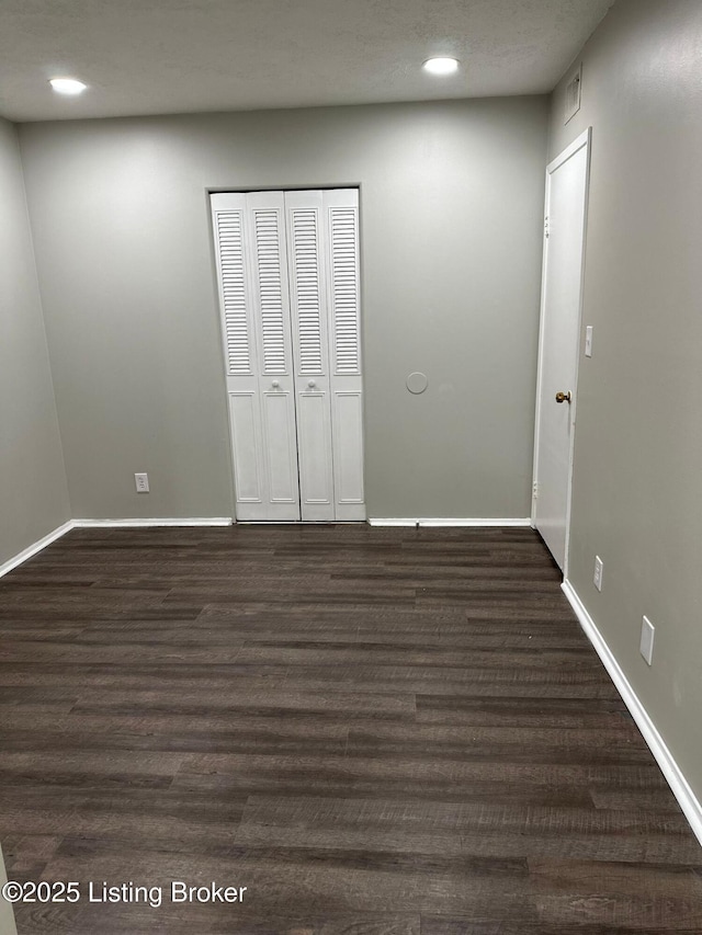 322 Mac Brae Rd, Louisville, KY 40214 - unfurnished bedroom featuring dark wood finished floors, recessed lighting, baseboards, and a closet
