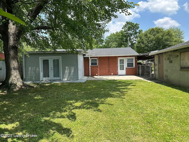 322 Mac Brae Rd, Louisville, KY 40214 - back of house with french doors, brick siding, and an outbuilding