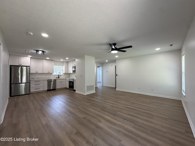 1129 Willow Oak Ln, La Grange, KY 40031 - unfurnished living room featuring a sink, baseboards, a ceiling fan, recessed lighting, and dark wood-style flooring