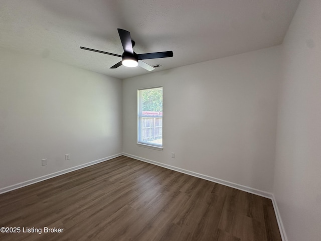 1129 Willow Oak Ln, La Grange, KY 40031 - unfurnished room with dark wood-style floors, baseboards, and ceiling fan