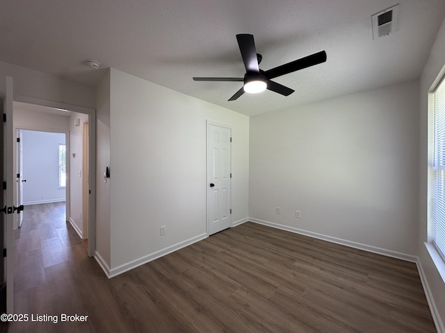 1129 Willow Oak Ln, La Grange, KY 40031 - unfurnished bedroom with dark wood finished floors, baseboards, and a ceiling fan