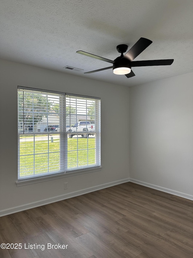 1129 Willow Oak Ln, La Grange, KY 40031 - spare room with a ceiling fan, plenty of natural light, wood finished floors, a textured ceiling, and baseboards