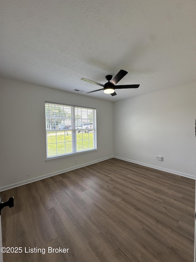 1129 Willow Oak Ln, La Grange, KY 40031 - spare room with baseboards, dark wood-type flooring, a ceiling fan, and a textured ceiling
