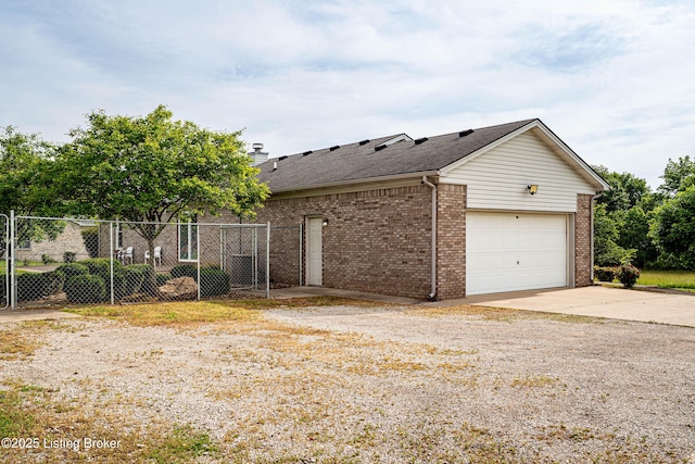 171 Williams Ct, Brooks, KY 40109 - view of property exterior featuring brick siding, driveway, roof with shingles, a chimney, and an attached garage