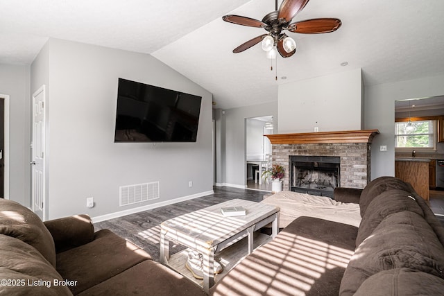 171 Williams Ct, Brooks, KY 40109 - living room featuring wood finished floors, a ceiling fan, lofted ceiling, baseboards, and a brick fireplace