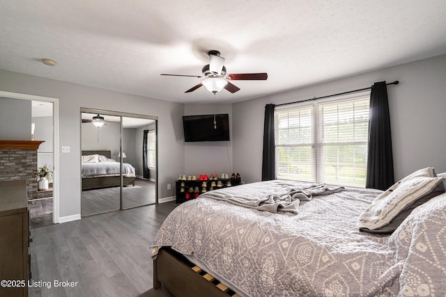 171 Williams Ct, Brooks, KY 40109 - bedroom with multiple windows, wood finished floors, a closet, baseboards, and a textured ceiling