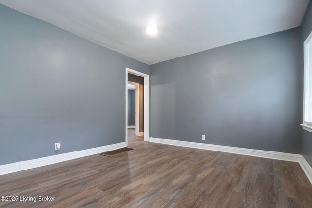 1119 Carlisle Ave, Louisville, KY 40215 - unfurnished room with wood finished floors and baseboards