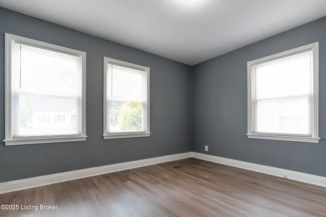 1119 Carlisle Ave, Louisville, KY 40215 - unfurnished room featuring dark wood-style floors and baseboards