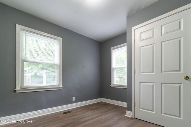 1119 Carlisle Ave, Louisville, KY 40215 - spare room with dark wood-style flooring and baseboards