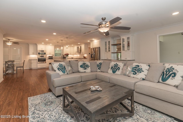 2401 Branning Rd, Thornhill, KY 40222 - living room featuring a ceiling fan, recessed lighting, dark wood-style flooring, and crown molding