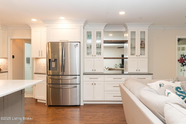 2401 Branning Rd, Thornhill, KY 40222 - kitchen with stainless steel fridge with ice dispenser, crown molding, white cabinetry, tasteful backsplash, and glass insert cabinets