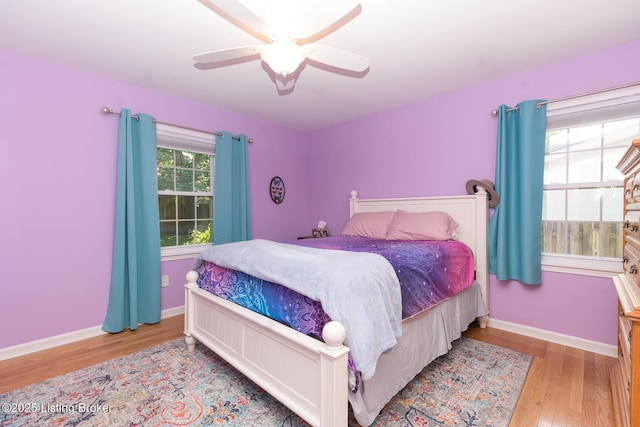 2401 Branning Rd, Thornhill, KY 40222 - bedroom with wood finished floors, baseboards, and a ceiling fan