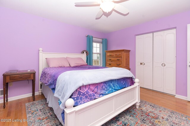 2401 Branning Rd, Thornhill, KY 40222 - bedroom featuring wood finished floors, a closet, ceiling fan, and baseboards