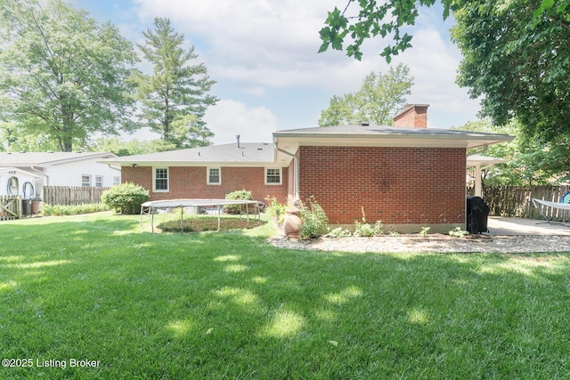 2401 Branning Rd, Thornhill, KY 40222 - back of property featuring a chimney, brick siding, and a patio