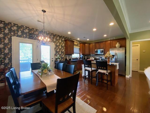 1013 Mallards Cv, Bardstown, KY 40004 - dining room featuring a chandelier, dark wood-style floors, recessed lighting, wallpapered walls, and baseboards