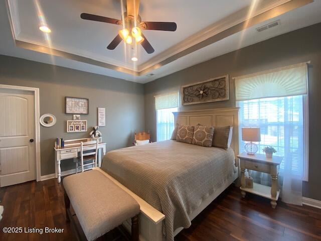 1013 Mallards Cv, Bardstown, KY 40004 - bedroom with a tray ceiling, wood finished floors, baseboards, ceiling fan, and crown molding