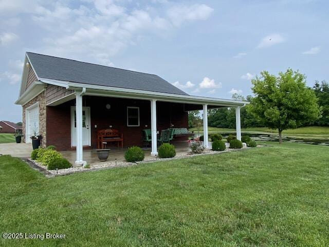 1013 Mallards Cv, Bardstown, KY 40004 - rear view of property featuring covered porch and a yard