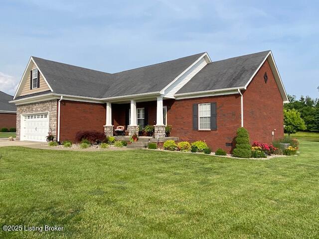 1013 Mallards Cv, Bardstown, KY 40004 - view of front of property with covered porch, brick siding, a front lawn, and concrete driveway