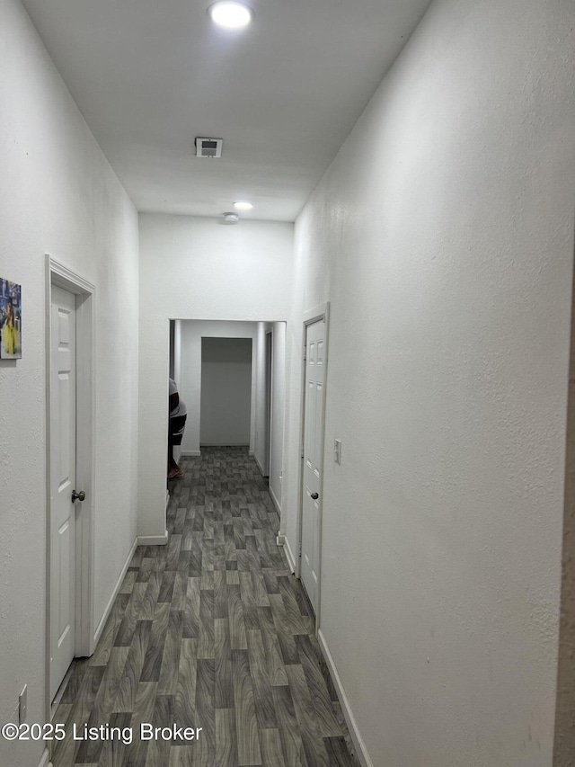 3229 Hale Ave, Louisville, KY 40211 - hallway featuring dark wood-type flooring and baseboards