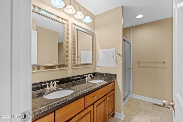 90 Chancellor Ct, Elizabethtown, KY 42701 - full bathroom with double vanity, a stall shower, baseboards, and tile patterned floors