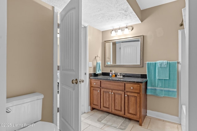 90 Chancellor Ct, Elizabethtown, KY 42701 - bathroom with vanity, a textured ceiling, tile patterned floors, toilet, and baseboards