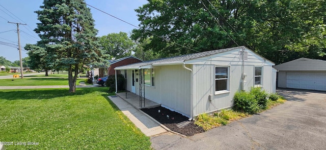 7125 Sky Blue Ave, Louisville, KY 40258 - view of property exterior with an outdoor structure, a yard, and a detached garage