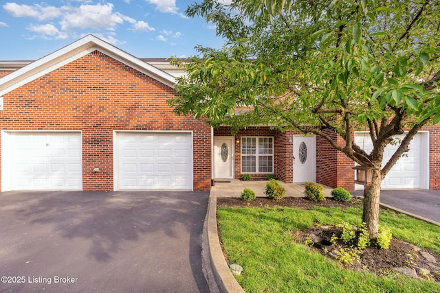 305 S Dorsey Ln, Louisville, KY 40223 - traditional-style home featuring asphalt driveway, brick siding, and an attached garage