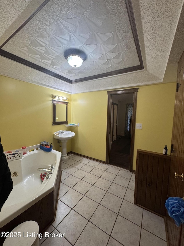1103 Foxfire Rd, Bardstown, KY 40004 - bathroom with a bath, tile patterned floors, a tray ceiling, and a textured ceiling