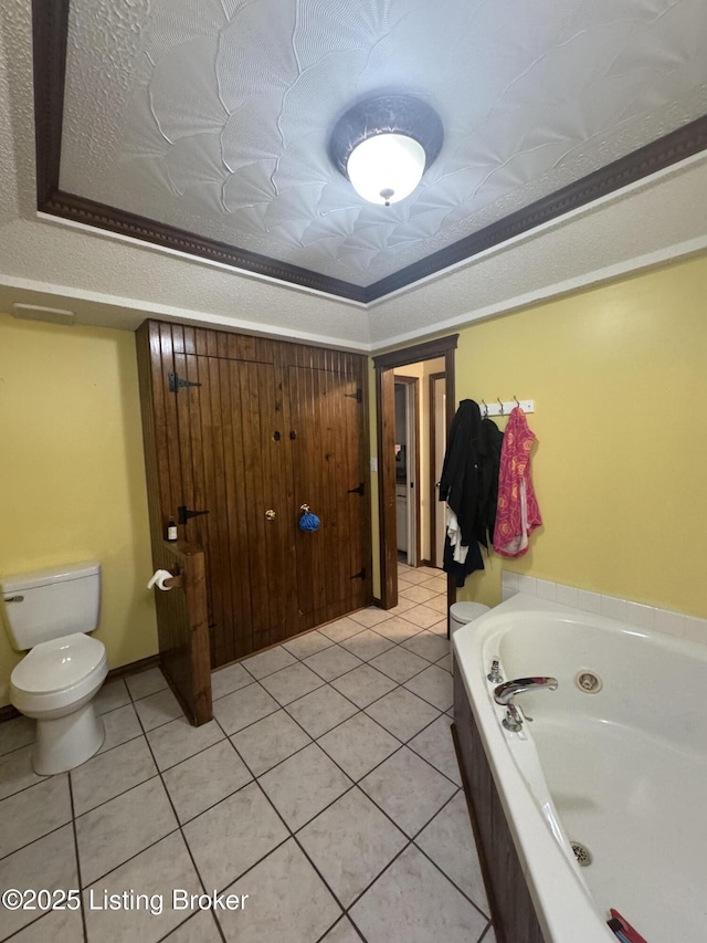 1103 Foxfire Rd, Bardstown, KY 40004 - full bath featuring a whirlpool tub, toilet, tile patterned floors, and a tray ceiling