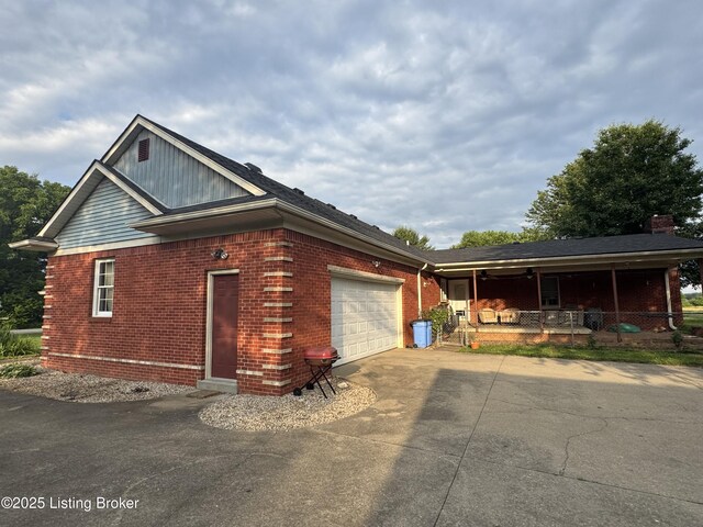 1103 Foxfire Rd, Bardstown, KY 40004 - view of front of property with a porch, driveway, an attached garage, brick siding, and a chimney