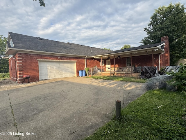 1103 Foxfire Rd, Bardstown, KY 40004 - view of front of property with a porch, brick siding, asphalt driveway, a garage, and a chimney