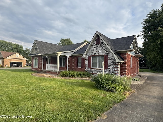 1103 Foxfire Rd, Bardstown, KY 40004 - view of front of property with covered porch, a front yard, brick siding, and roof with shingles