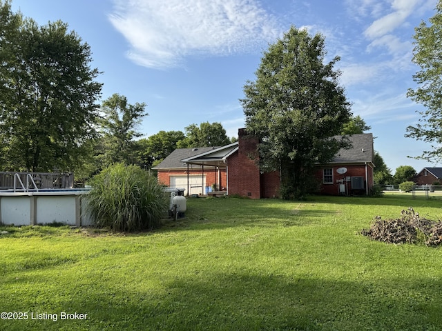 1103 Foxfire Rd, Bardstown, KY 40004 - view of grassy yard with an outdoor pool