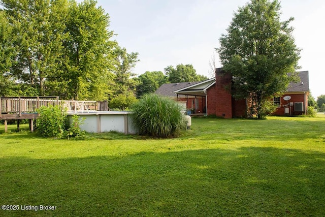 1103 Foxfire Rd, Bardstown, KY 40004 - view of grassy yard with a deck and an outdoor pool