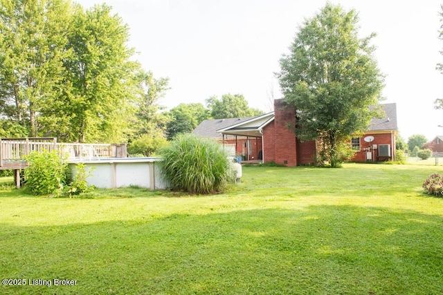 1103 Foxfire Rd, Bardstown, KY 40004 - view of green lawn featuring an outdoor pool and a wooden deck