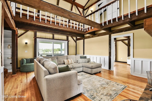 1416 Taylor Wood Rd, Simpsonville, KY 40067 - living area featuring wood finished floors, wainscoting, and a high ceiling