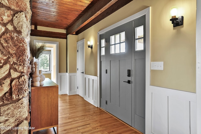1416 Taylor Wood Rd, Simpsonville, KY 40067 - entryway featuring wood ceiling, wainscoting, plenty of natural light, a decorative wall, and light wood finished floors