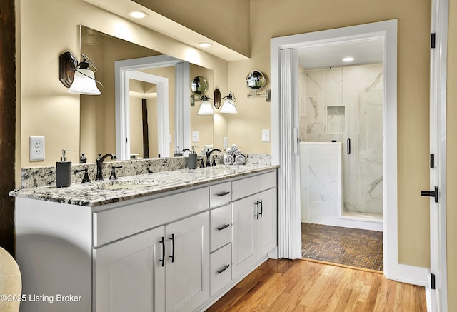 1416 Taylor Wood Rd, Simpsonville, KY 40067 - full bath featuring double vanity, a marble finish shower, recessed lighting, and wood finished floors