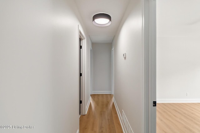 4205 Cottagehill Rd, Louisville, KY 40299 - corridor featuring light wood-style floors, baseboards, and attic access