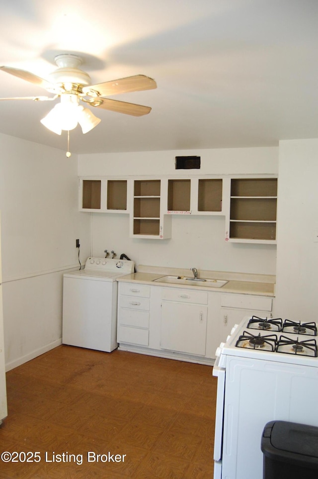 9530 Maple Rd, Louisville, KY 40229 - kitchen featuring washer / dryer, open shelves, a sink, and white gas range oven