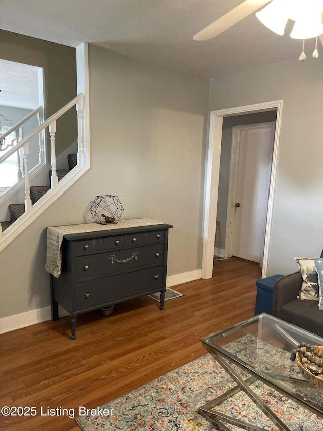 2623 Parklawn Dr, Louisville, KY 40217 - living area with wood finished floors, baseboards, a ceiling fan, and stairs