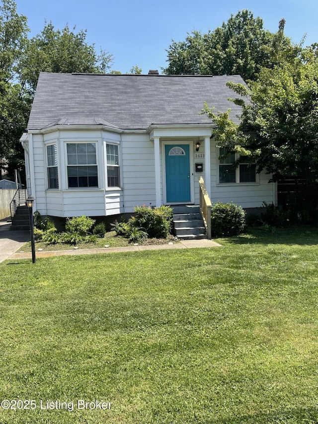 2623 Parklawn Dr, Louisville, KY 40217 - view of front of house with a front lawn and roof with shingles