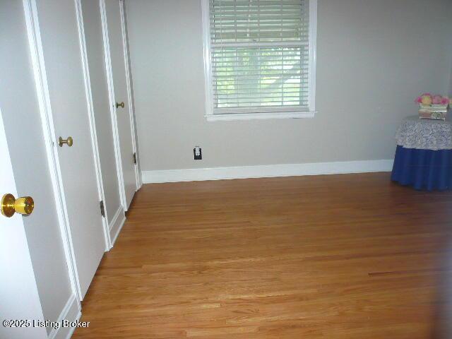 1411 Falcon Dr, Louisville, KY 40213 - unfurnished room featuring light wood-style floors and baseboards