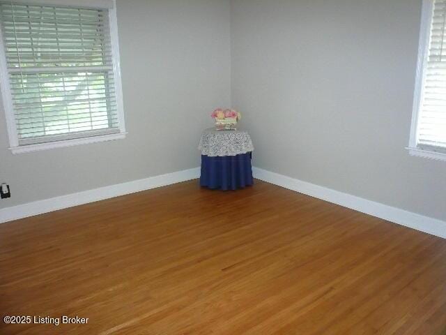 1411 Falcon Dr, Louisville, KY 40213 - spare room featuring wood finished floors and baseboards
