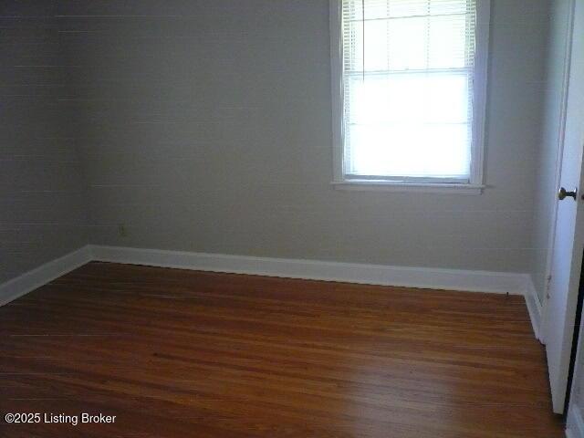 1411 Falcon Dr, Louisville, KY 40213 - unfurnished room with wood finished floors and baseboards