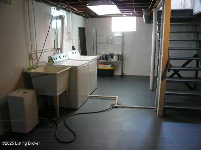 1411 Falcon Dr, Louisville, KY 40213 - basement featuring washing machine and dryer and stairs