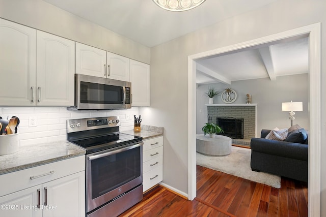 828 Dorsey Ln, Louisville, KY 40223 - kitchen with appliances with stainless steel finishes, dark wood-style flooring, beam ceiling, light stone countertops, and tasteful backsplash